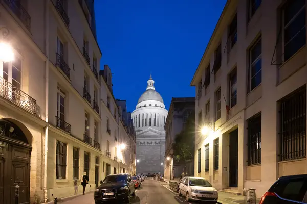 stock image Dusk settles over Rue Valette with Le Pantheon dome illuminated in the background in Paris.