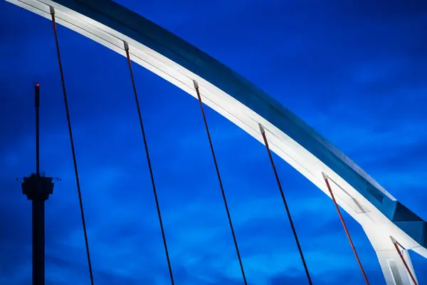 stock image Detail of the Barqueta Bridge, Seville, Spain. Tied arch bridge designed by the engineers Juan Jose Arenas and Marcos Pantaleon, 1989-1992.