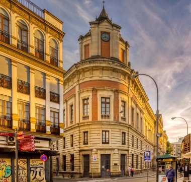 Modernist building designed by architect Ramon Balbuena y Huertas in 1916, located in Seville, Spain. Notable for its intricate facade and historic significance. clipart