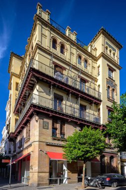 Modernist building designed by architect Ramon Balbuena y Huertas in 1916, located in Seville, Spain. Notable for its intricate facade and historic significance. clipart