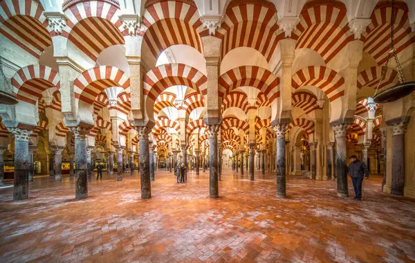 stock image The iconic red and white arches inside the Mosque-Cathedral of Cordoba.