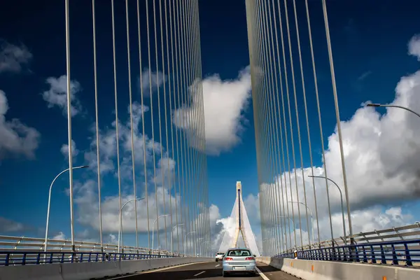 stock image Photo of the Constitution of 1812 Bridge, also known as La Pepa Bridge, located in Cadiz, Andalusia, Spain with cars driving under a blue sky.