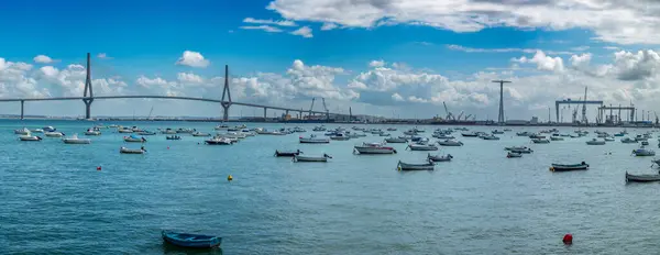 Stock image Scenic view of Constitution of 1812 Bridge, also known as La Pepa Bridge, over Cadiz Bay with boats and shipyards in the background.