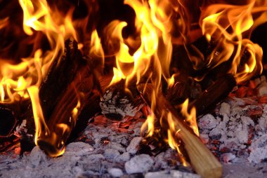 Charcoal for Barbecue Background With Flames menu, recipe and comfort food concept.