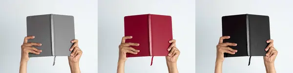 İnsanların elleri gri, kırmızı ve siyah kitapları tutuyor. İzole edilmiş beyaz arka planda bir kadının el bilgisayarı..