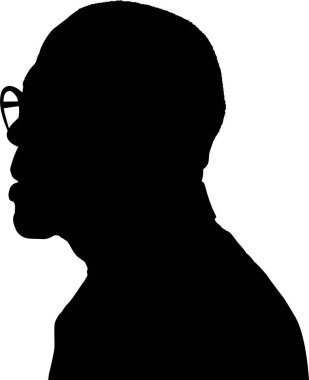 Sola bakan gözlüklü bir adam silueti.