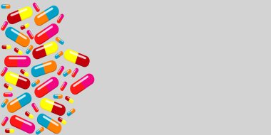 Gri Arkaplana Dağılmış Renkli Kapsüller ve Haplar