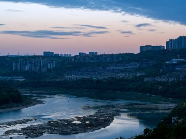 Yangtze river shoal visible in Chognqing city, China, during the low water level season clipart