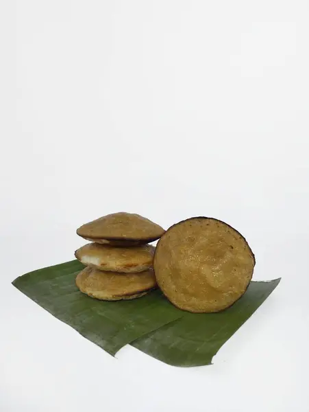 stock image Serabi on a banana leaf with a white background - Serabi is a typical Indonesian food that has a chewy and sweet savory texture