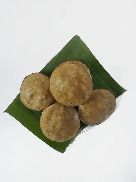 stock image Serabi on a banana leaf with a white background - Serabi is a typical Indonesian food that has a chewy and sweet savory texture