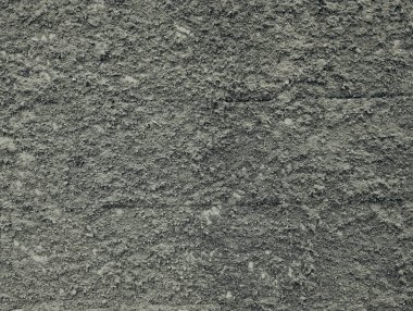 Pürüzlü duvar. Duvardaki tuğla tabakasını kaplamak için çimento ve kum karışımı..