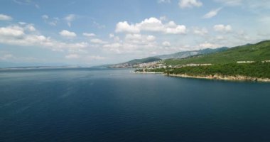 beaches and emerald sea surface, touristic paradise, drone overhead footage