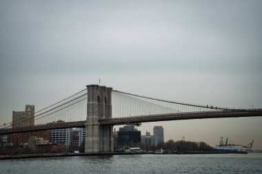 Brooklyn Bridge with Manhattan skyline in background in New York City