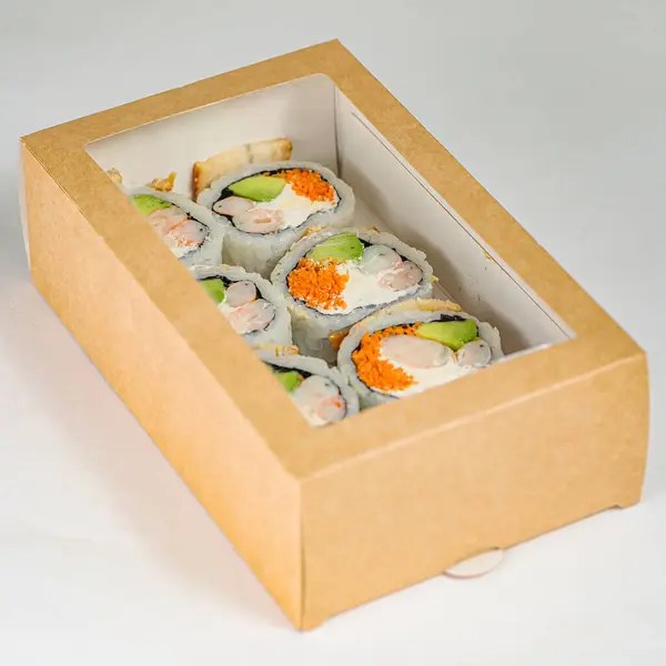 A box of sushi is opened, revealing a tempting assortment of freshly prepared sushi waiting to be devoured.