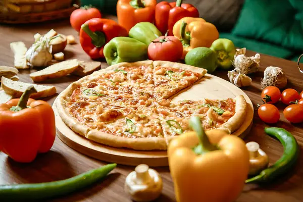 A delicious pizza placed on top of a rustic wooden table.