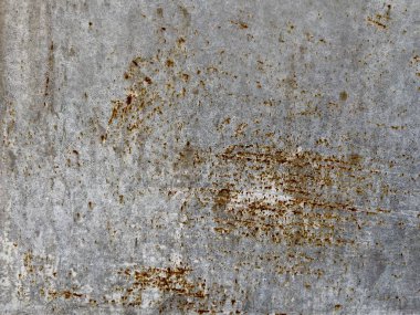 Paslı metal bir yüzeye yakın plan, yıpranmış çizikler ve aşınma izleri var. Endüstriyel arka planlar, grunge ya da klasik tasarım projeleri için mükemmel..