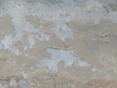 Çizik ve çatırtı olan duvar parçası. Renkli duvar kâğıdının deseni soyulan eski, kirli, deri döken arka plan sıvısı. Arka plan için yüzey duvarı betonu deseni. Gri arka plan eski rengi ve yumuşak arka plan deseni süngerlenmiş..