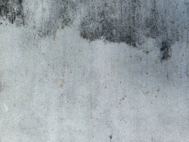 Eski beton duvarın dokusu. Açık gri çimento desenli beton duvar. Gri pastel, sert, çatlak, çimento, beton, kaya, alçılı sıva duvar..