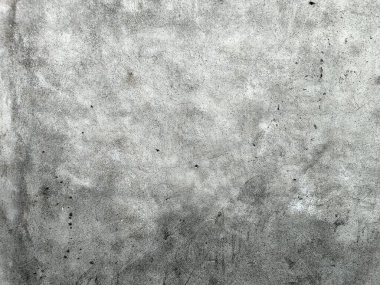 Grunge Scratched Gray Beton Duvarı Arka planı. Tırmalanmış ve yıpranmış beton duvar yüzeyinin pürüzlü gri grunge dokusu. Arka planda, üstüste, inşaat temalarında, kentsel tasarım projelerinde, grunge-style düzenleme ve dijital dokularda kullanım için idealdir.