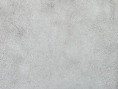 Grunge Scratched Gray Beton Duvarı Arka planı. Tırmalanmış ve yıpranmış beton duvar yüzeyinin pürüzlü gri grunge dokusu. Arka planda, üstüste, inşaat temalarında, kentsel tasarım projelerinde, grunge-style düzenleme ve dijital dokularda kullanım için idealdir.