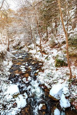 Snow landscape of the Aude River in the Pyrenees in France clipart