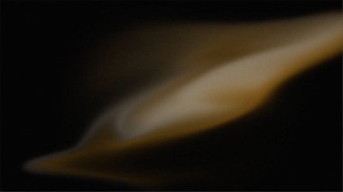 Siyah zemin üzerinde altın rengi olan saten gibi soyut tasarım