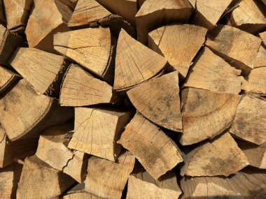 Firewood background. Firewood stack. Stacked split logs. Woodpile. Firewood for winter. High quality photo clipart