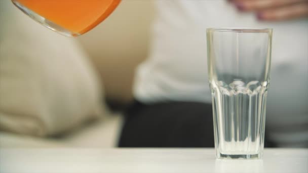 Slowmotion Close Video Pregnant Woman Pouring Orange Juice Glass Concept — Stockvideo