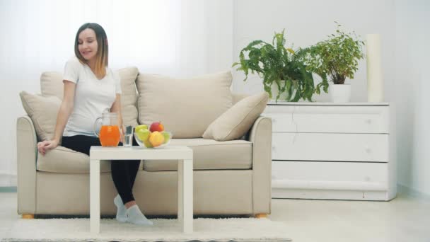 Slowmotion Video Pregnant Woman Showing Thumb Sitting Sofa Concept Pregnant — Stock video