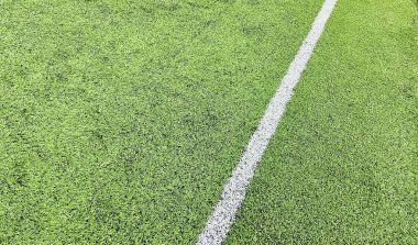 Aerial view white line grass mini soccer field. A well maintenance field to play mini soccer clipart