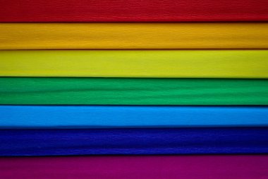 çok renkli kağıdın arkaplanı. Gökkuşağı şeklinde renkli bir kağıt. Arkaplan ve sunumlar için