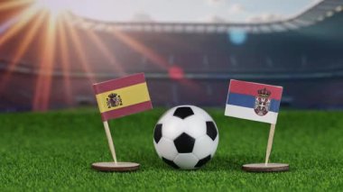İspanya ve Sırbistan milli bayraklarla futbol maçı, yeşil sahada futbol topu ve stadyum arka planı, uluslararası spor müsabakalarını ve rekabeti temsil ediyor.