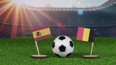 Ulusal bayraklarla İspanya ve Belçika futbol maçı, yeşil sahada futbol topu ve stadyum arka planı, uluslararası spor rekabeti ve rekabeti sembolize ediyor.