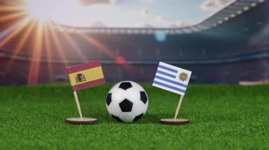 İspanya ve Uruguay 'ın ulusal bayraklarla rekabeti, yeşil sahada futbol topu ve stadyum arkaplanı uluslararası spor müsabakası ve gururu sembolize ediyor. yakınlaştır