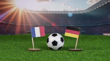 Fransa, Almanya 'ya karşı ulusal bayraklarla futbol rekabeti, yeşil sahada futbol topu ve bulanık stadyum Avrupa spor müsabakalarını sembolize ediyor. yakınlaştır