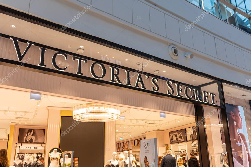 Poznan, Poland - March 22, 2025: Victoria's Secret lingerie store entrance with glowing logo, stylish mannequins and modern interior inside bright shopping mall boutique