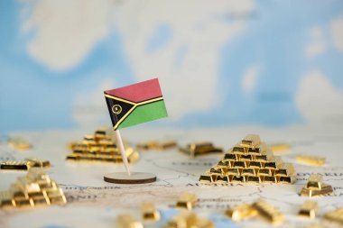 Vanuatu bayrağı, ulusal refahı, yatırım fırsatlarını ve geniş kopya alanı ile küresel ekonomik bağlantıları gösteren bir dünya haritası üzerinde parıldayan altın külçeler arasında gururla duruyor.