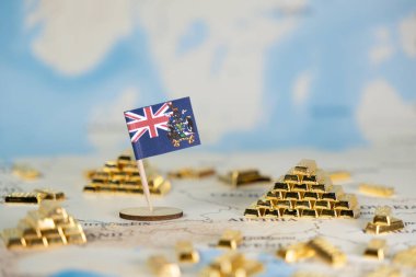 Uluslararası finans, yatırım stratejisi ve servet birikimini temsil eden detaylı bir dünya haritasında altın külçeleri bulunan Güney Gürcistan ve Güney Sandviç Adaları 'nın küçük bir bayrağı