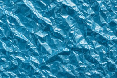 crumpled blue plastic texture background. blue color.