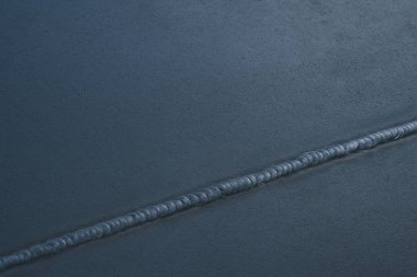 Koyu arkaplanda mavi ip, yakın görünüm