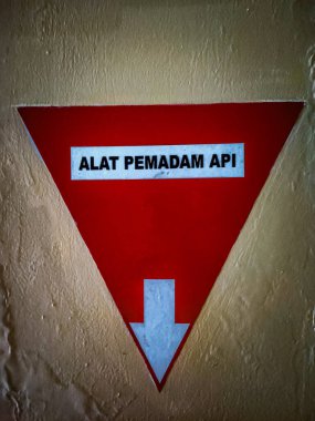 a sign that says a fire extinguisher or a symbol for a fire extinguisher storage area