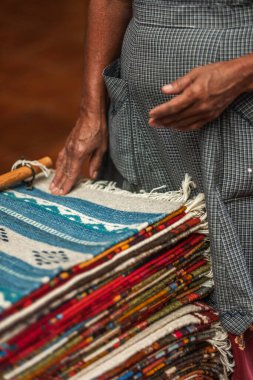 A closeup of the intricate process of making artisanal rugs or tapetes in Teotitlan Oaxaca clipart