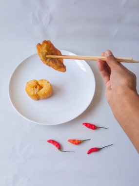 Gorengan : Fried food is one of the most popular types of snacks in Indonesia. Indonesian street food.Black background. clipart