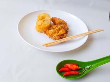 Gorengan : Fried food is one of the most popular types of snacks in Indonesia. Indonesian street food.Black background. clipart