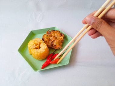 Gorengan : Fried food is one of the most popular types of snacks in Indonesia. Indonesian street food.Black background. clipart