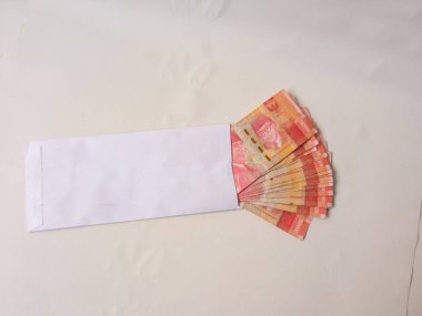 Cash payment concept. Indonesian rupiah currency (Rp. 100.000 Seratus Ribu Rupiah), One hundred thousand Indonesian rupiah money.