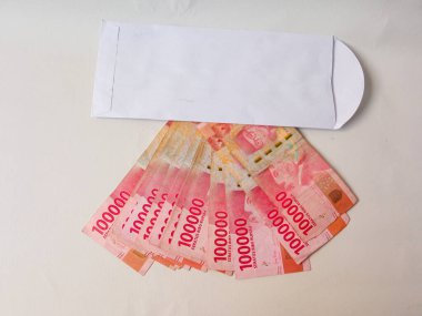 Cash payment concept. Indonesian rupiah currency (Rp. 100.000 Seratus Ribu Rupiah), One hundred thousand Indonesian rupiah money.