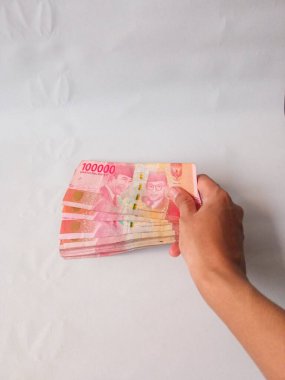 Nakit ödeme kavramı. Endonezya rupiası (Rp. 100.000 Seratus Ribu Rupiah), 100.000 Endonezya rupiası.