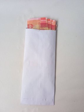 Cash payment concept. Indonesian rupiah currency (Rp. 100.000 Seratus Ribu Rupiah), One hundred thousand Indonesian rupiah money.