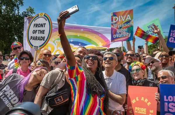 stock image London / UK - Jun 29 2024: London mayor Sadiq Khan poses for a selfie at the  annual Pride in London parade. The celebration brings together people from LGBTQ+ communities.
